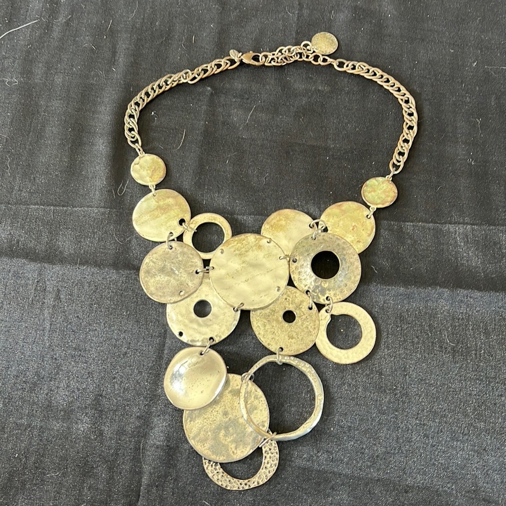Chicos statement bib necklace with silver rings.20in adjustable.